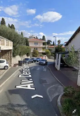 a street with a row of white signs on the road at Suggestivo appartamento in Saint-Jean-Cap-Ferrat