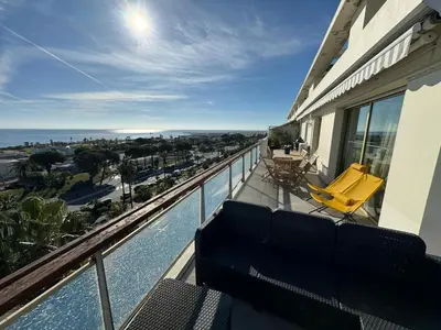 a balcony of a house with a view of the ocean at NICE, Exceptional Sea View, Top Floor, Parking in Nice