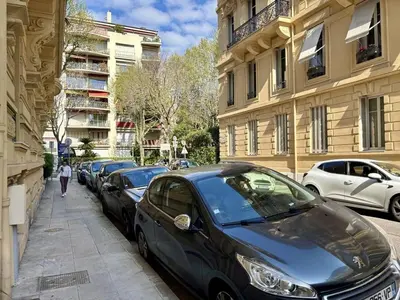 a row of cars parked on the side of a street at Nice Signature Delille in Nice