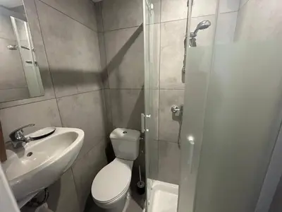 a bathroom with a toilet and a sink and a shower at Nice Signature Assalit Studio in Nice