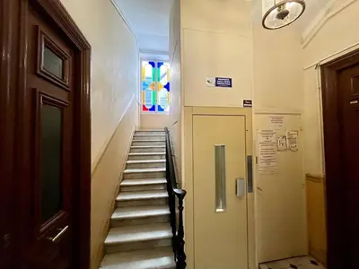 a stairway in a building with a stained glass window at Nice Signature Assalit 2P in Nice