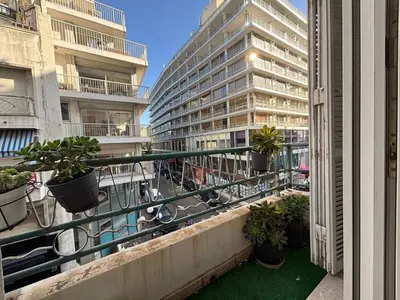 a balcony of a building with potted plants on it at Nice Signature Halévy in Nice