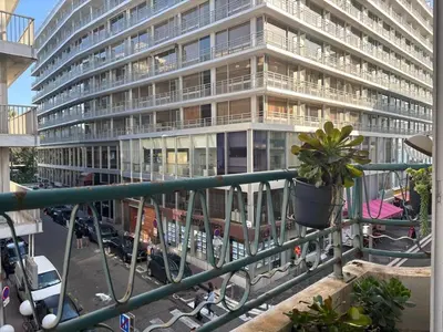a large building with a potted plant in front of it at Nice Signature Halévy in Nice