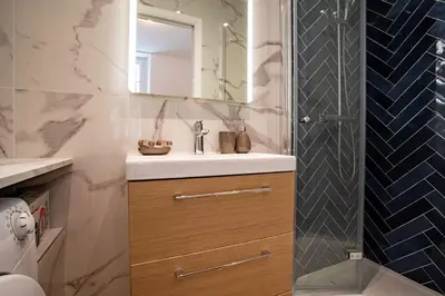 a bathroom with a sink and a shower at ICONIC AP4460 By Riviera Holiday Homes in Nice