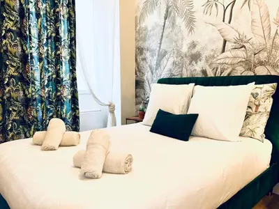 a bedroom with a bed with towels on it at Old Town Vibes - 5min to Sea - AC & Breakfast in Nice