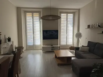 a living room with a couch and a table at Port de nice in Nice