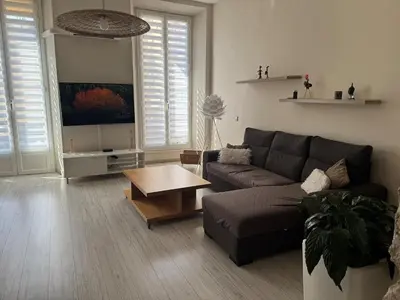 a living room with a couch and a coffee table at Port de nice in Nice