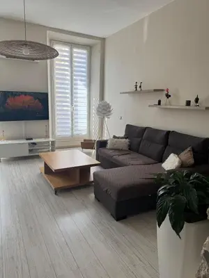 a living room with a couch and a coffee table at Port de nice in Nice