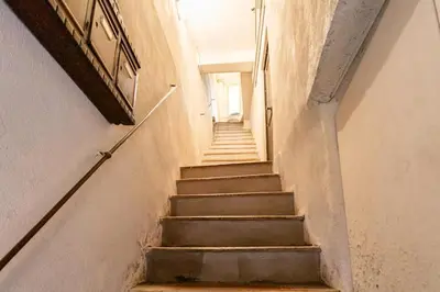 a stairway in a building with stairs leading up at #5 Eagle Nest 5mins walk of the Sea AC Wifi Old town in Nice