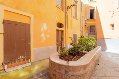 a building with a planter in front of a building at #5 Eagle Nest 5mins walk of the Sea AC Wifi Old town in Nice