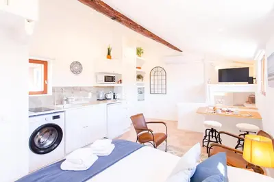 a white room with a bed and a kitchen at #5 Eagle Nest 5mins walk of the Sea AC Wifi Old town in Nice