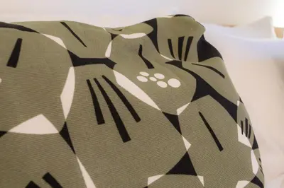 a close up of a pillow with a pattern on it at #45 Quiet chic 5mins walk to port and beach AC Wifi in Villefranche-sur-Mer