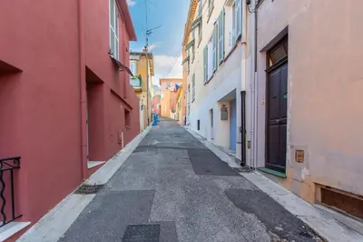 an empty alleyway between buildings in a city at #45 Quiet chic 5mins walk to port and beach AC Wifi in Villefranche-sur-Mer
