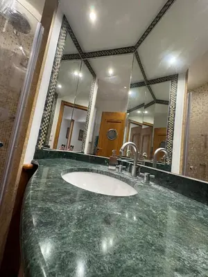a bathroom with a sink and a large mirror at Seaside Serenity, Portside Apartment in Èze