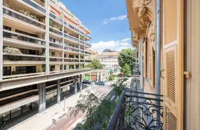 an apartment balcony with a view of a street at Cozy studio near the sea in Nice