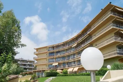 a large building with balconies on the side of it at Lovely 4-person studio - pool and sea in Cros-de-Cagnes