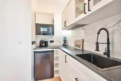 a kitchen with a stainless steel sink and a sink at Appartement Cosy centre Nice in Nice