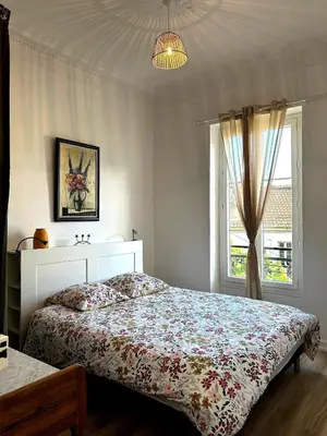 a bedroom with a bed and a window at Charming Flat in Nice Villa in Nice