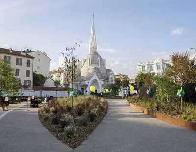 a building with a spire in the middle of a street at Liberation Cozy Studio in Nice in Nice