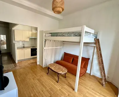 a living room with a bunk bed and a couch at Liberation Cozy Studio in Nice in Nice