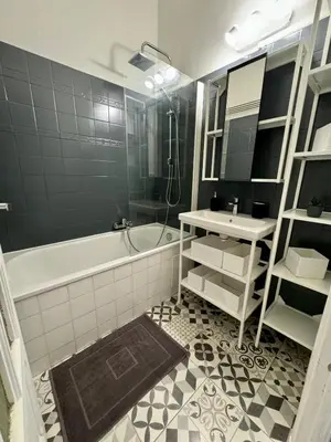 a bathroom with a tub and a sink at Liberation Cozy Studio in Nice in Nice