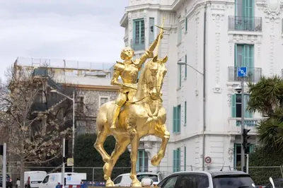 a gold statue of a man riding a horse at Liberation Cozy Studio in Nice in Nice