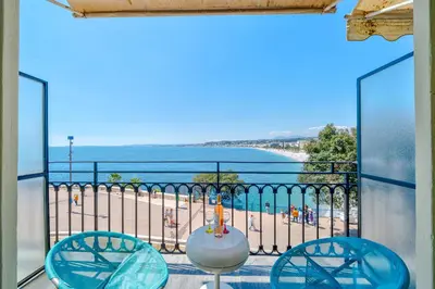 a balcony with a view of the beach at Panoramic Sea View - Promenade des Anglais in Nice