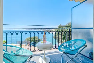 a balcony with two chairs and a view of the ocean at Panoramic Sea View - Promenade des Anglais in Nice