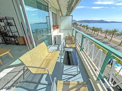 a balcony with chairs and a view of the ocean at Sea Front Holiday Saphir in Nice