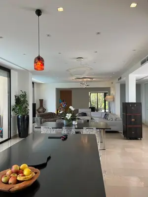 a living room with a table with a bowl of fruit on it at La perle - villa de luxe in Villefranche-sur-Mer