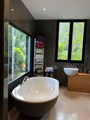 a large bathroom with a large tub and a sink at La perle - villa de luxe in Villefranche-sur-Mer