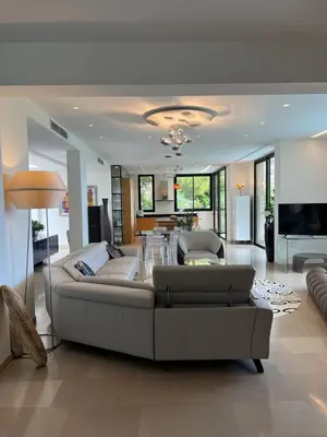 a large living room with a couch and a table at La perle - villa de luxe in Villefranche-sur-Mer