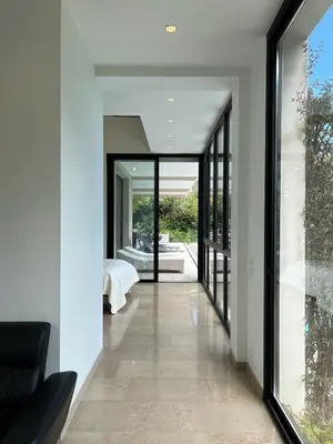 a hallway of a house with sliding glass doors at La perle - villa de luxe in Villefranche-sur-Mer
