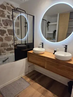 a bathroom with two sinks and a large mirror at Au Passage Niçois in Nice