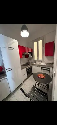 a kitchen with a table and a small table in it at Two bedroom Apartment to rent in Nice in Nice