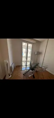 a living room with a table and a laptop in it at Two bedroom Apartment to rent in Nice in Nice