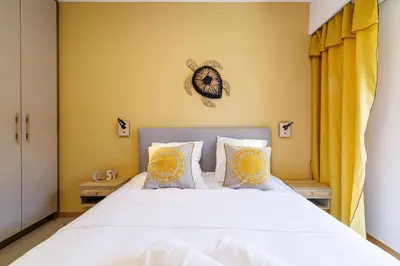 a bedroom with a bed with a clock on the wall at MY CASA - GAIRAUT - 5 rooms - Terrasse in Nice