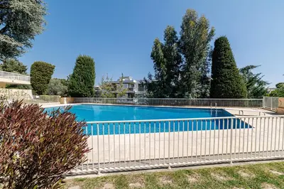 a swimming pool with a white fence around it at MY CASA - GAIRAUT - 5 rooms - Terrasse in Nice