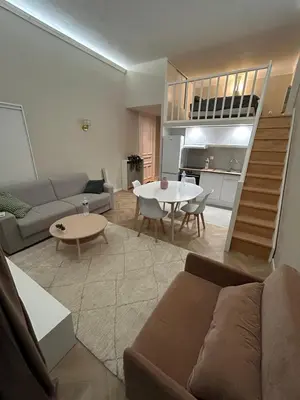 a living room with a couch and a table at Sea Side, Modern, Nice Promenade in Nice