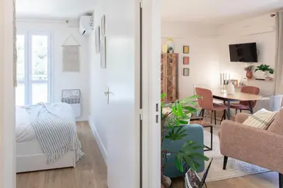 a living room with a couch and a table at #46 Terrace AC 4mins walk Sea Tram T2 Airport Port in Nice