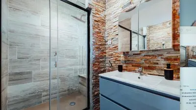 a bathroom with a sink and a glass shower at Nice barelli in Nice