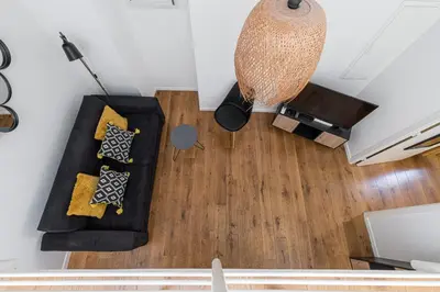 an overhead view of a living room with a couch at 33 GAMBETTA - Appartement 2 pieces Mezzanine in Nice