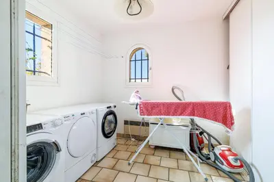a laundry room with a washer and dryer at VILLA LAVANDINE - Maison Provencale avec Piscine - Magnifique vue in Aspremont