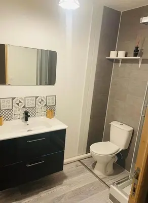 a bathroom with a toilet and a sink at Fully-equipped 2-bedroom apartment in Nice