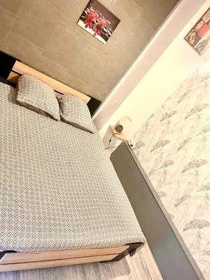 a bedroom with a bed in a room at Fully-equipped 2-bedroom apartment in Nice
