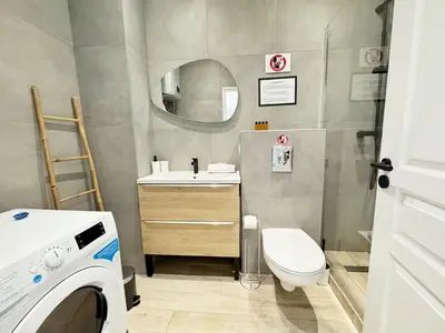 a bathroom with a toilet and a sink and a mirror at RF105 - Authentique 3P Nice centre in Nice