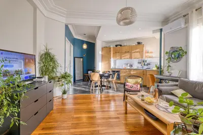 a living room with a couch and a table at Cocon D'Azur - 5min from the beach - Happy Rentals in Nice