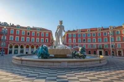 a statue in a plaza in front of a building at Cocon D'Azur - 5min from the beach - Happy Rentals in Nice