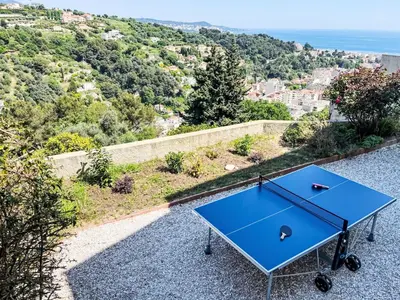 a blue table sitting on the side of a hill at Holiday Home Villa la Bergerie by Interhome in Nice