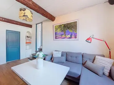 a living room with a couch and a table at Apartment Le Mascoïnat by Interhome in Nice